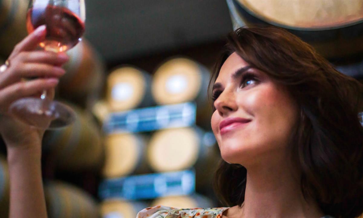 Woman looking at wine glass