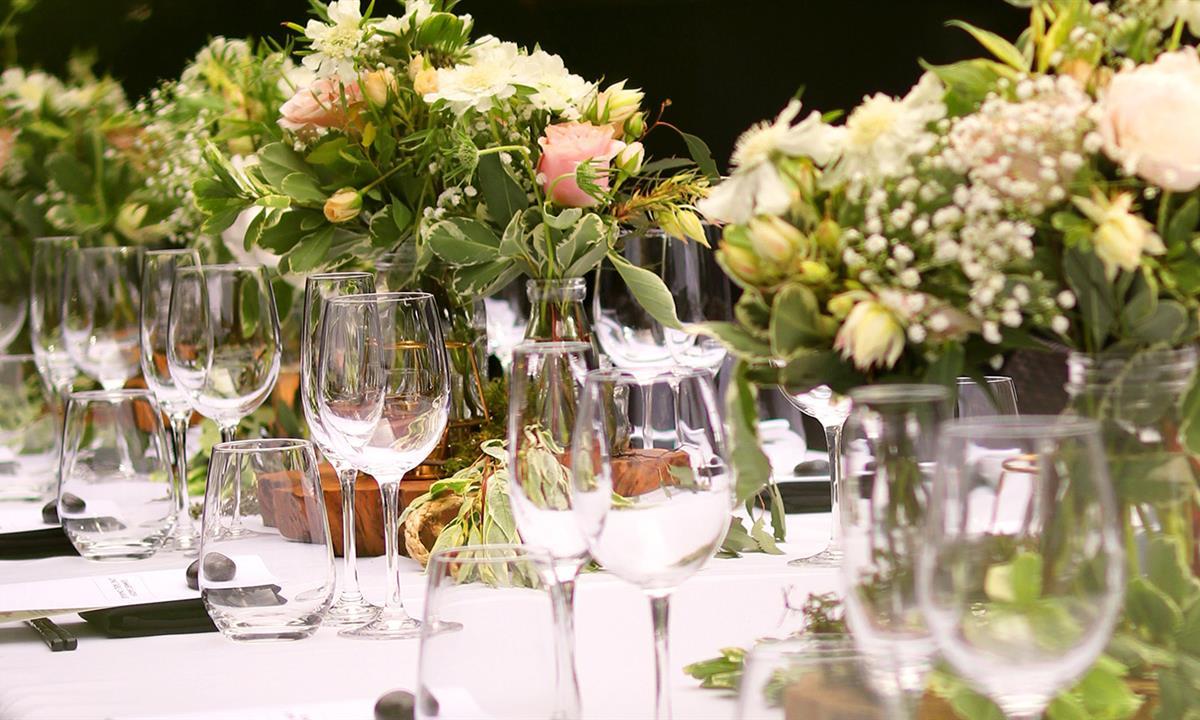 large wedding table set with floral arrangements